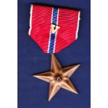Use Bronze Star Medal with (V) Clasp which was awarded for valour in the field. Excellent example.