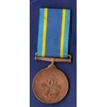 South Africa Police Service Medal 'SERVAMUS ET SERVIMUS 1913 - 1988' named to 175516B T Konst, A.