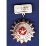 North Vietnamese Soldier to be emulated badge with 1972 clasp. Good badge