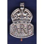 WWII Air Raid Warden’s ARP (Air Raid Precautions) badge. White metal with a pin back.