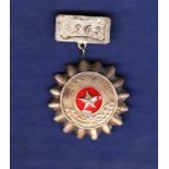 North Vietnamese Soldier to be emulated badge with 1963 clasp. Good badge