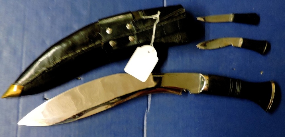 Ceremonial Kukri Knives  In black leather sheath with metal tip and belt loop.