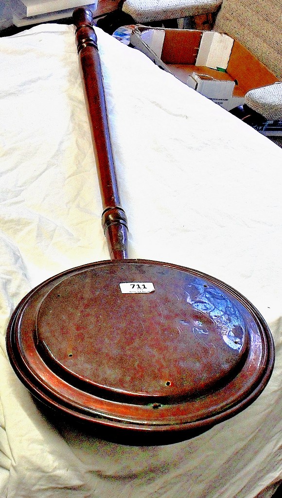 A long handled Copper Bed Warming Pan.