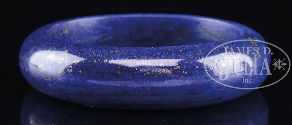 LAPIS LAZULI BANGLE. China. Typical form with gold inclusions. SIZE: Outer: 3-1/8" dia. Inner: 2-1/