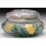 DAUM NANCY POWDER JAR. Acid cutback floral design in green with gold highlights rest against a