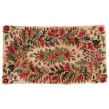 EARLY HOOKED FLORAL RUG. This 19th century rug with cream background and multiple red roses with a
