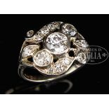 14KT WHITE GOLD DIAMOND LADY'S RING. The center diamond surrounded by 13 various sized diamonds.