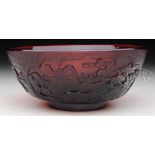 PEKING GLASS BOWL. 18th century, China. Ruby colored. Carving of three reserves with the "San