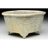 GE-TYPE NARCISSUS PLANTER. The quatrefoil body with everted rim supported on four ruyi shaped