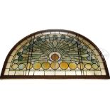 LARGE LEADED GLASS WINDOW. Beautiful half-round leaded glass window features stylized peacock