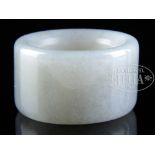 GRAY JADE ARCHER'S RING. China. Of typical form, the tone of an even gray. SIZE: 1-3/8" dia. Inner