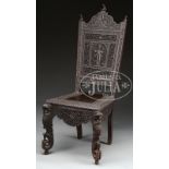 ANGLO-INDIAN CHAIR. Early 20th century, India. Backsplat with carved deity surrounded by florals and