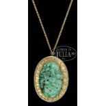 JADEITE CARVED GOLD PENDANT WITH CHAIN. China. Jadeite with peaches, florals and leafy branches.