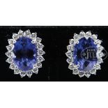 FINE PAIR OF TANZANITE, DIAMOND AND PLATINUM PIERCED EARRINGS. The earrings marked "PT950", each
