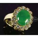 JADEITE CABOCHON AND DIAMOND RING. China. Jadeite with brilliant apple green tone. Accompanied by