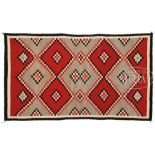 NAVAJO REGIONAL RUG. Typical diamond step pattern in red, brown, white and camel. SIZE: 74" l x 43-