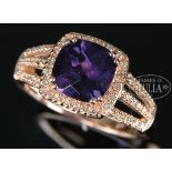 14KT ROSE GOLD DIAMOND AND AMETHYST LADY'S RING. The center square cut amethyst in deep color