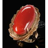 LARGE BLOOD CORAL GOLD RING. China. Coral deep red tone and oval shaped. Stamped "14k" inside