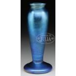QUEZAL INDIGO STEM VASE. Late 19th, early 20th Century. Iridescent indigo with pale olive green