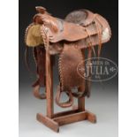 PARADE SADDLE WITH SILVER MOUNTS AND FANCY CARVING. Found in Western Canada, first half 20th