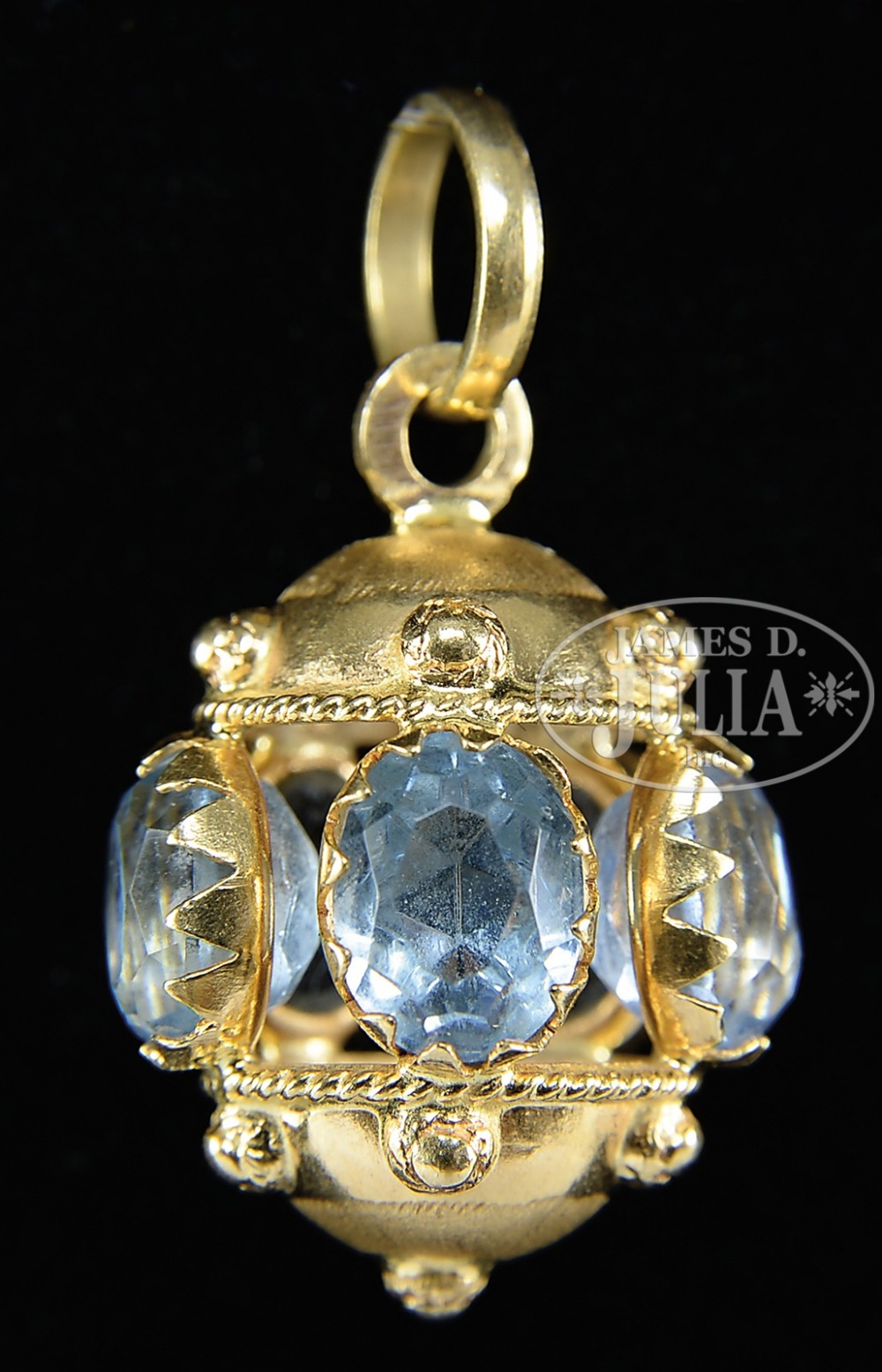 INTERESTING BLUE STONE 18KT PENDANT. The pendant marked "750". Lantern form with open center