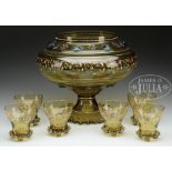 PUNCHBOWL SET. Late 19th Century Central Europe. Comprised of a footed bowl and 6 cups. Glass of a