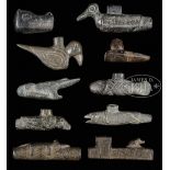 LOT OF TEN CARVED SOAPSTONE PREHISTORIC STYLE EFFIGY PIPES. Lot includes: Four birds, a fish, a