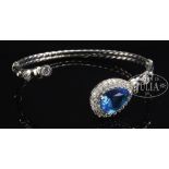 DESIGNER STERLING BANGLE BRACELET WITH SIMULATED DIAMONDS AND BLUE STONES. Marked "925" having a