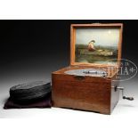 THE OLYMPIA OAK CASED 9" DISC MUSIC BOX WITH EXTRA RECORDS. The hinged oak case opens to reveal a