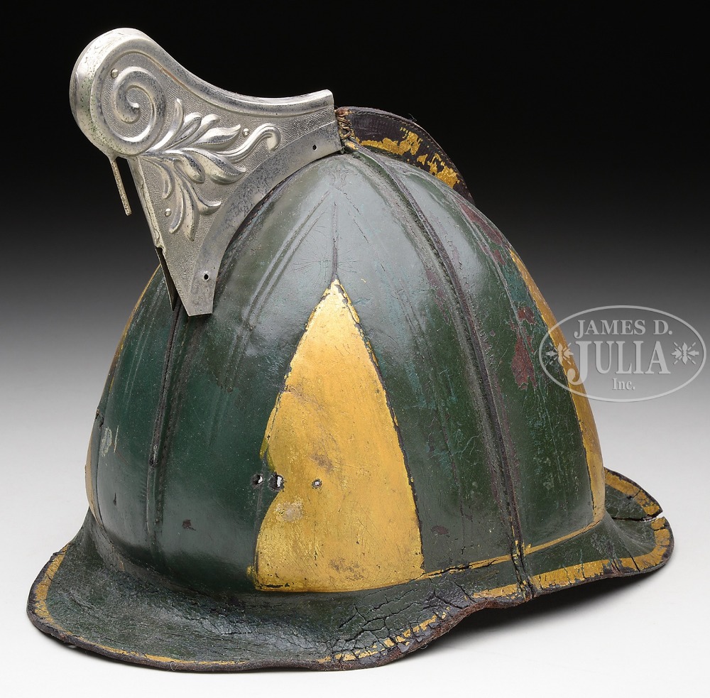 CHILD'S PAINTED LEATHER AND METAL FIRE HELMET. A small size antique 19th century helmet in green and