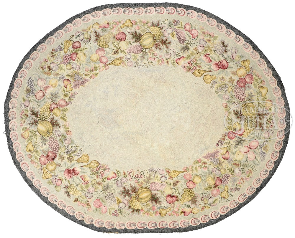 OVAL WOOL RUG WITH FRUIT MOTIF. 2nd half 20th century. Oval cut wool hand hooked rug with fruit
