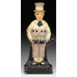 BOY HOLDING FRUIT BASKET DOORSTOP. Circa 1920, American. Unknown foundry, the hollow half round
