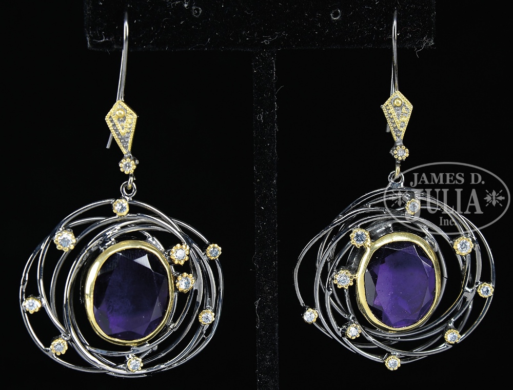 PAIR OF STERLING AND PURPLE STONE AND SIMULATED DIAMOND PIERCED EARRINGS. The backs marked "925".