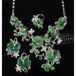 SUITE OF JADEITE JEWELRY WITH DIAMONDS. The well-designed jewelry set includes a large necklace, two