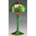 RARE TIFFANY STUDIOS INTAGLIO CUT LAMP. Lamp begins with a green favrile glass shade that is