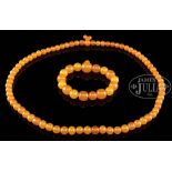 AMBER ROSARY AND NECKLACE. 20th century, China. SIZE: Largest bead: 3/8" dia. 3" across. Rosary: