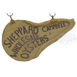 OYSTER TRADE SIGN "SHEPPARD CAMPBELL WHOLESALE OYSTERS'". The painted, oyster form sign is one sided