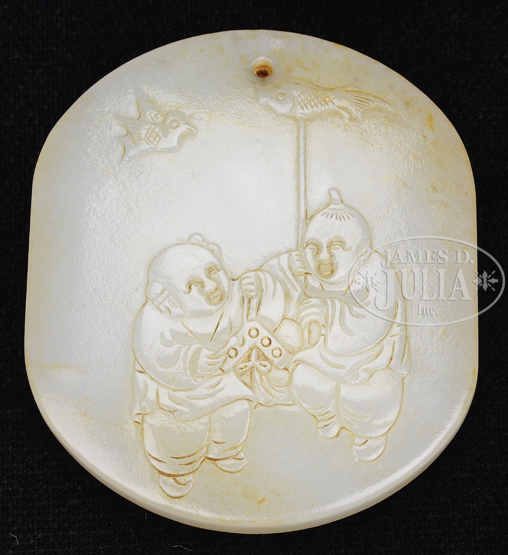 WHITE JADE PENDANT. China. Carving of two boys on one side and bamboo on the other. SIZE: 2" h.