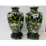 CLOISONNE, pair of Chinese cloisonne black ground floral design oviform, 8.5" height, on carved
