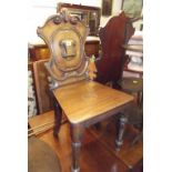 HALL CHAIRS, pair of early Victorian mahogany carved shoulder back hall chairs