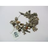 CHARM BRACELET, silver charm bracelet set various charms including cherub, windmill, whale etc,