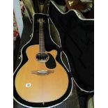 TAKAMINE, A Japanese electric acoustic tan 40 guitar with cool tube and case