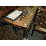 GATE LEGGED TABLE; Jacobean design oak oval topped gate legged table with a single drawer with