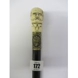 WALKING CANE, an interesting carved bone portrait grip walking cane with embossed vine banding