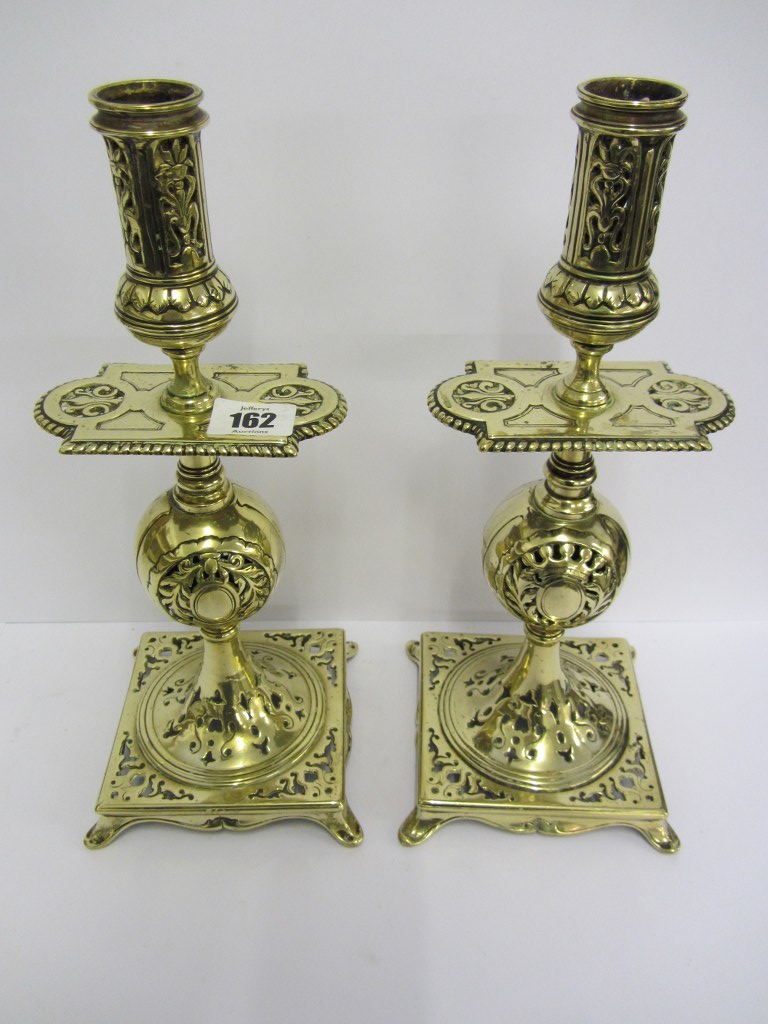 METALWARE, an ornate pair of pierced brass square base 12" candlesticks