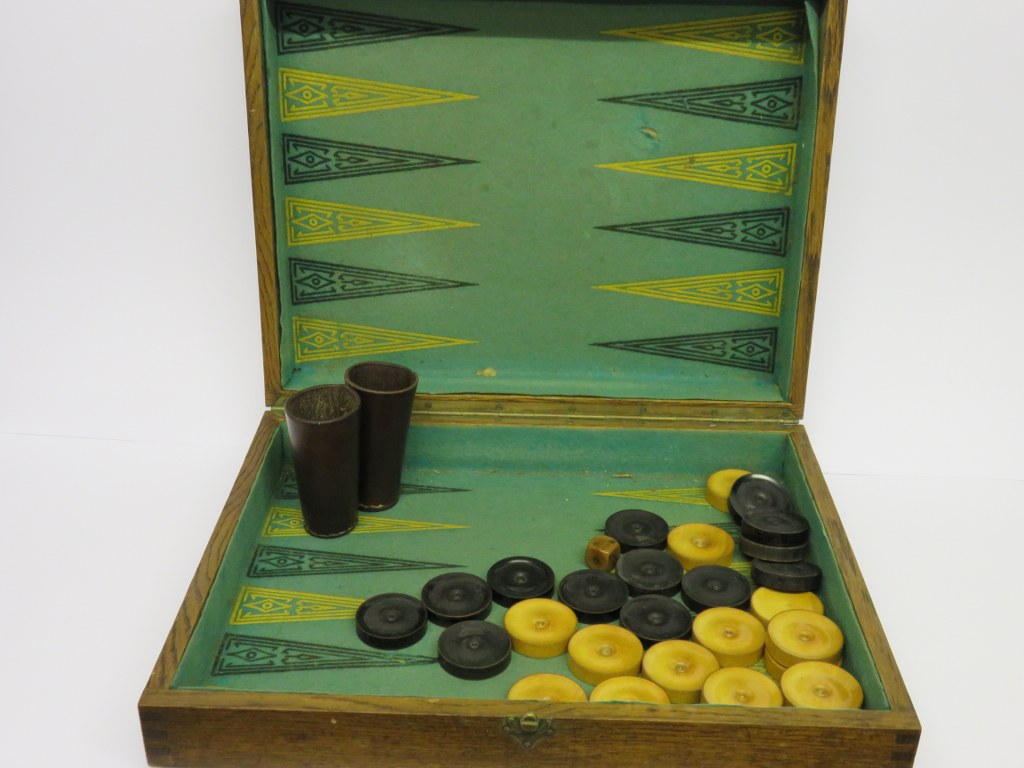 BACKGAMMON SET, oak cased backgammon set with boxwood and ebony counters