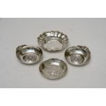 A pair of embossed silver ashtrays, an e