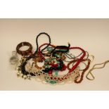 A bag of various costume jewellery
