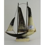Small sailing boat ornament made from a