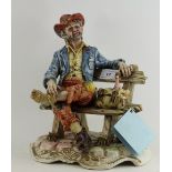 Capodimonte piece of a man on a bench